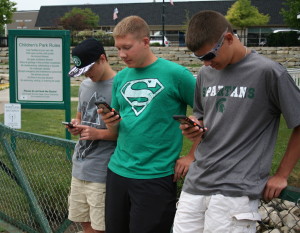Lake Orion residents Hunter Foxlee, 16, and Brandon and Chandler Kadulski, 17 and 15 respectively, stop to play some Pokemon GO in Children’s Park. The park is a hotspot for players with many ‘Poke Spots’ in the vicinity and an active Pokemon presence. Photos by Cathy Kimmel-Srock.