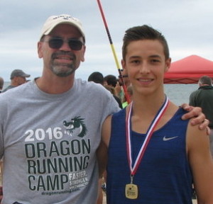 Zach Dinverno, of Lake Orion, pictured with his coach Adam Russell, won his age division at the Grand Haven Beach Vault. Photo submitted.