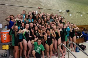 The LOHS girls swimming and diving team gives the “three” sign after winning the Wayne State Relay Invitational for the third year in a row.  Photo provided.