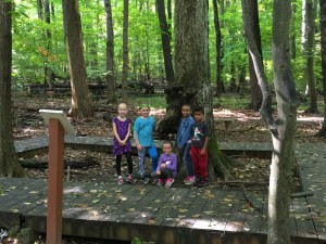 Students from Webber Elementary stand at the Moose Tree at the Moose Tree Nature Center. School administrators recommended closing Webber and selling the complex, including the nature center, at the school board’s meeting on Sept. 28. Photo by Georgia Thelen