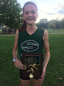 Above, Novak with her Oakland County Middle School trophy. Photo provided.