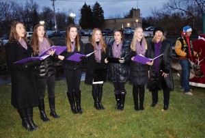 The Violettes (above, from left) Lia Catallo, Sophia Wahl, Alaina Johns, Zoe Nygaard, Isabelle Paradoski, Seeka Woodworth (of Lake Orion) and Jennifer Kincer from Kincer Voice Studio in Rochester delighted the crowd with Christmas carols during the Downtown Tree Lighting ceremony. 