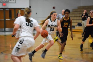  Guard Tessa Nuss on a fast-break after a N. Farmington turnover, with Sophia Rose Wyborski (no. 55 in white) offering support. Photo by Jim Newell