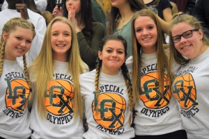 (From left) Freshmen Lydia Hanson, Gillian Cyr, Olivia Carroll, Renee Rizzo and Morgan Spina wore their LOX (Lake Orion/Oxford) t-shirts and cheered during the game.