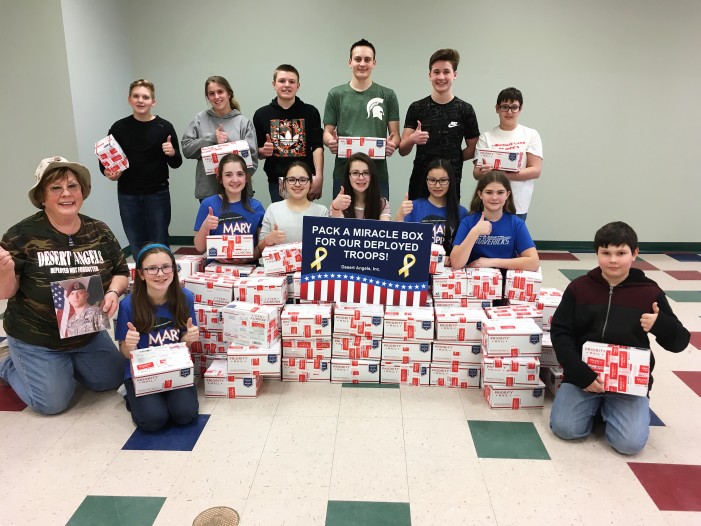 Area students pack Miracle Boxes to send to troops overseas
