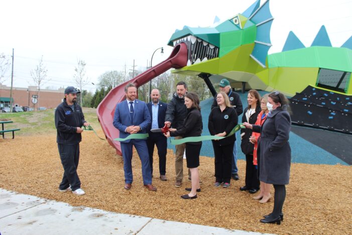 Orion Twp. officials celebrate the grand opening of the Playful Dragon