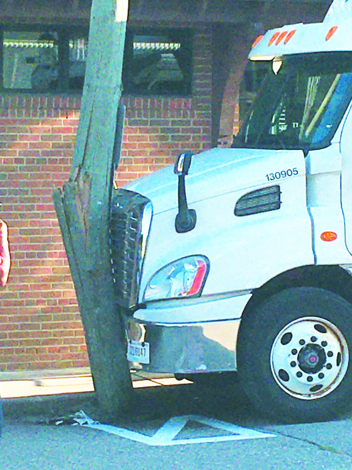 Semi crashes into electrical pole in downtown Lake Orion on Sat.