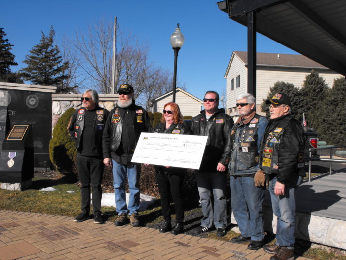 Legion Riders help with Orion Veterans Memorial wall repairs