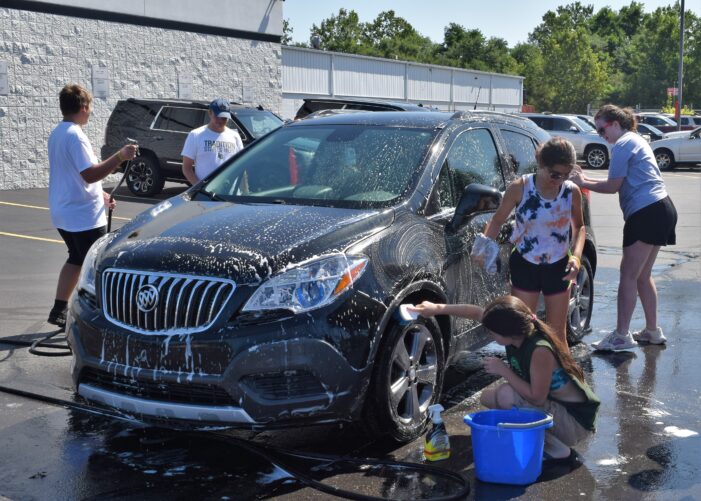 Spick and span thanks to the LOHS marching band: students hold car wash fundraiser